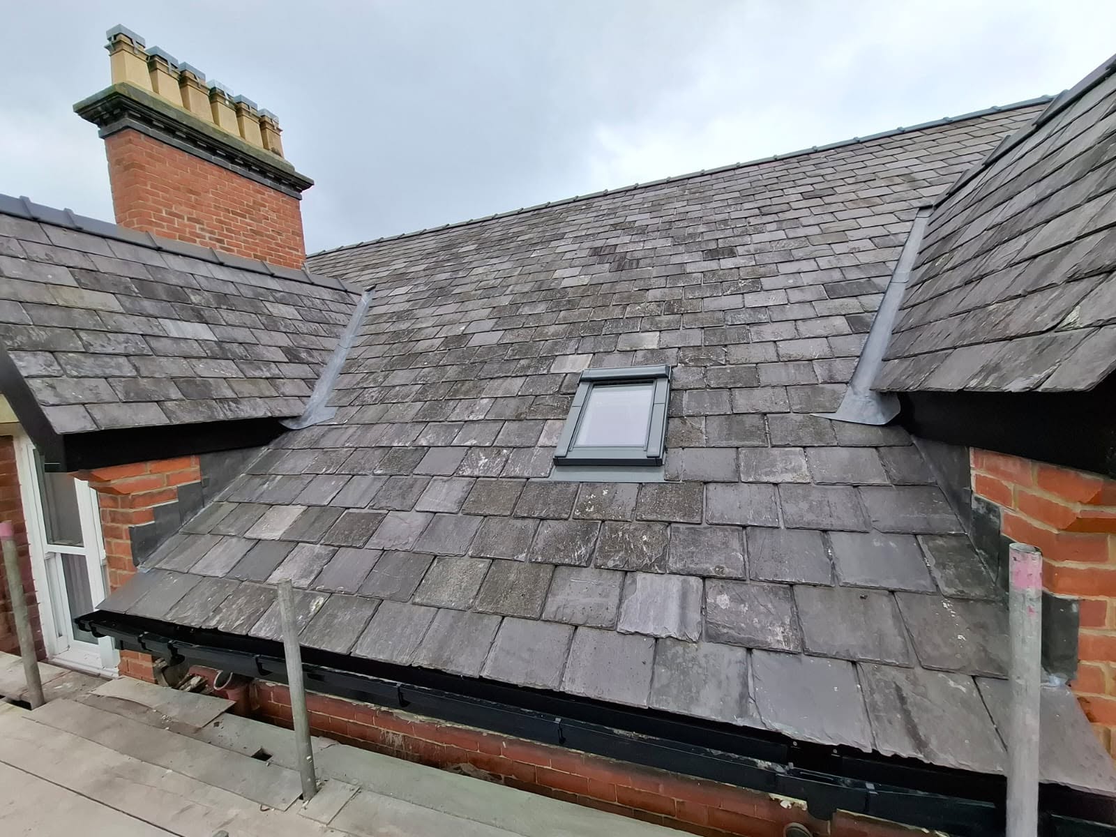 Traditional Welsh slate roof laid on a stone property in North Wales